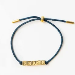 INK + ALLOY Goldie Navy Lurex Cord With Brass Letters Adjustable Peace